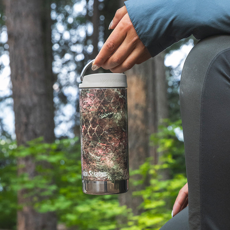 12oz-tkwide-with-twist-cap-mossy-oak-l4 12oz_tumbler_mossyoak_rainbowtrout_hand_closeup_square.jpg