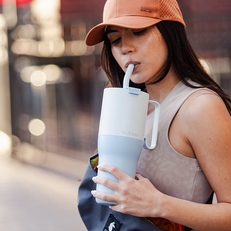 36oz-rise-tumbler-with-straw-lid-a6 36oz_rise_tumbler_straw_girl_sip_square.jpg