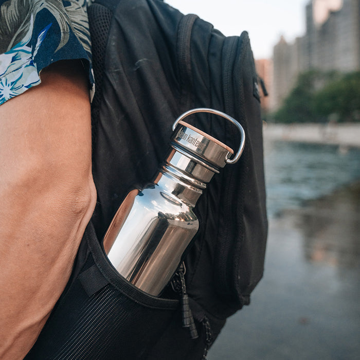 27oz-reflect-with-bamboo-cap-t1 K27SSLRF-MS-BAMBOO_reflect-bottle_backpack_lifestyle.jpg